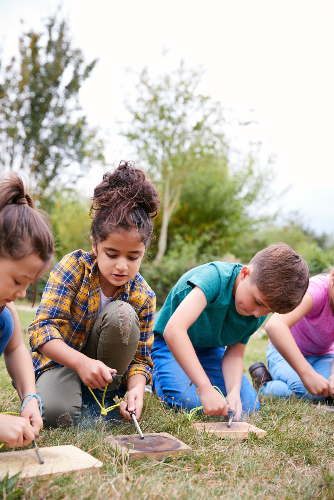 Group of Children on Outdoor Camping Trip Learning How to Make F